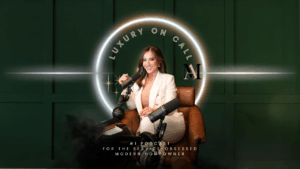 Alexandra Miklosova holding a microphone podcast sitting in a chair - Real Estate Podcast